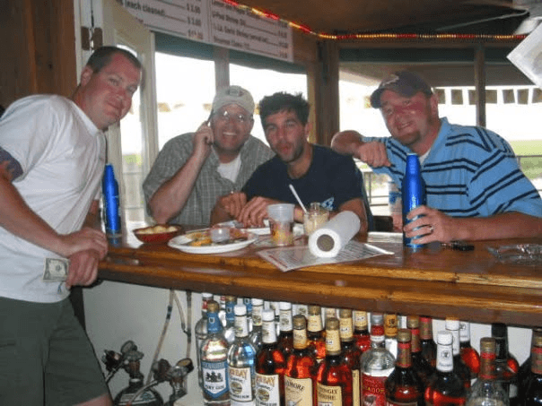 Bar counter with drinks, bottles, and shared plates