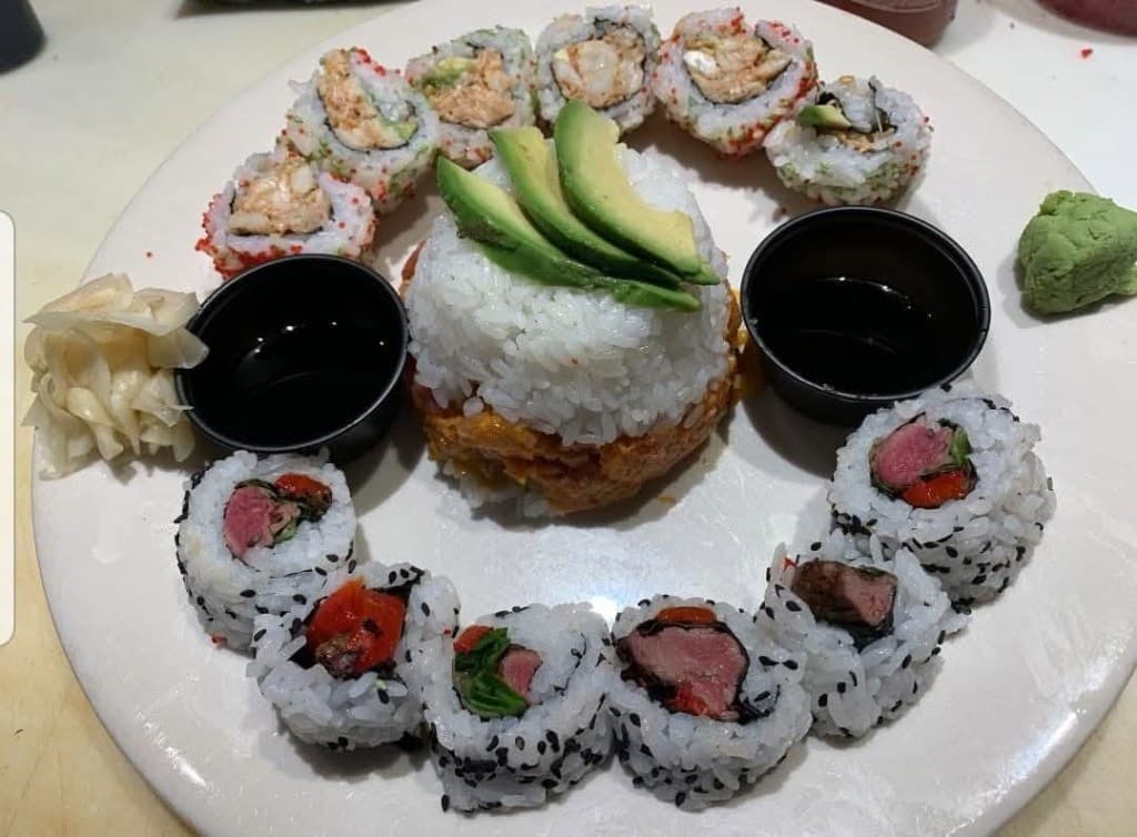 Sushi tower platter with avocado and specialty rolls